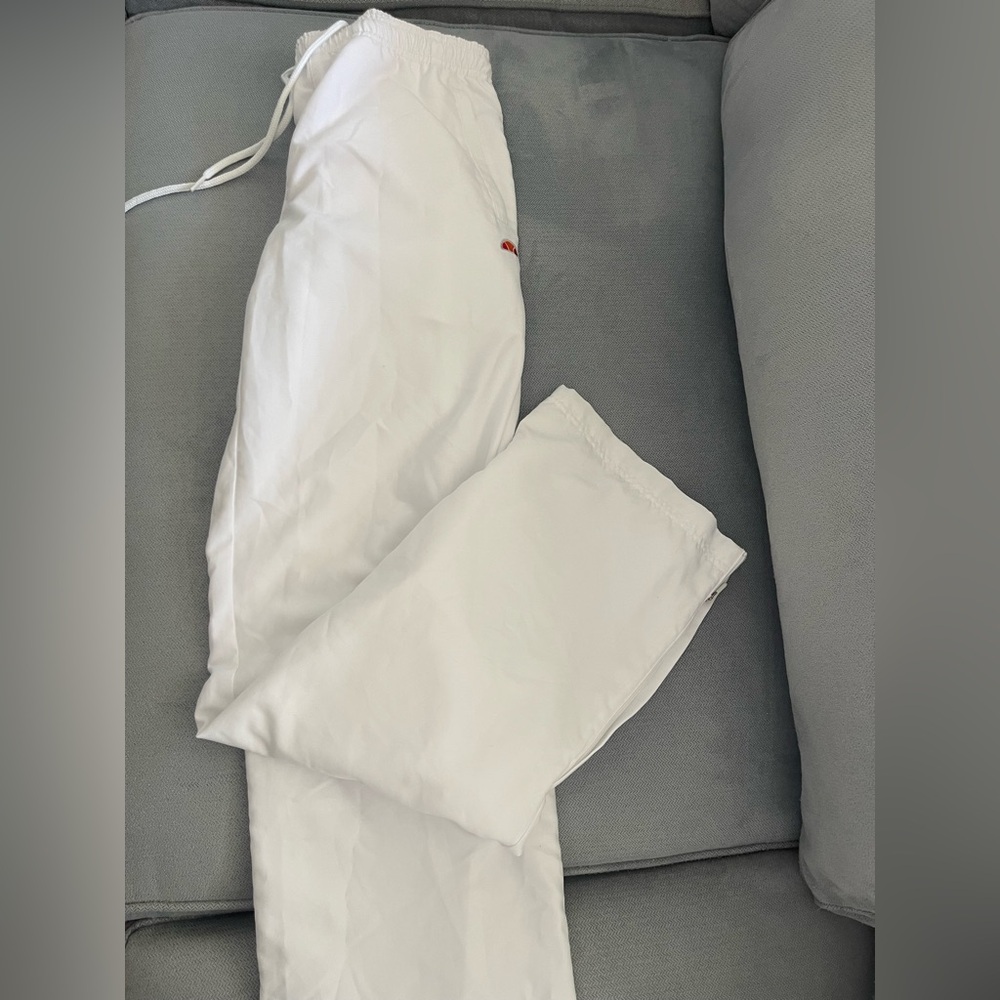 Ellesse white track pants in size small